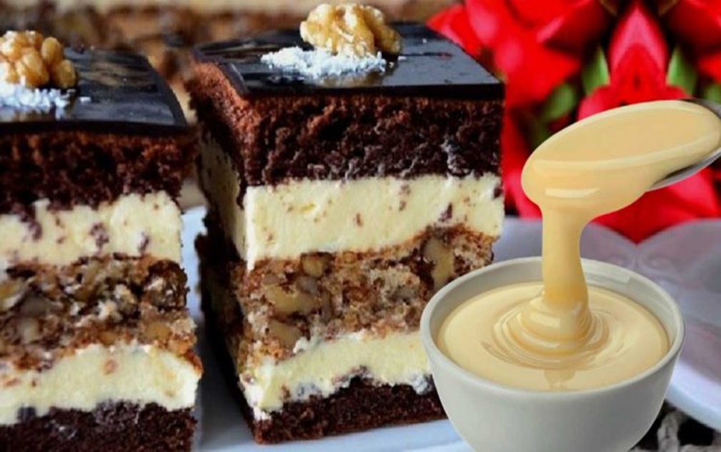 Prăjitura imperială este o combinație armonioasă de arome și texturi, îmbinând un blat bogat de cacao cu unul crocant de nuci și o cremă fină de vanilie